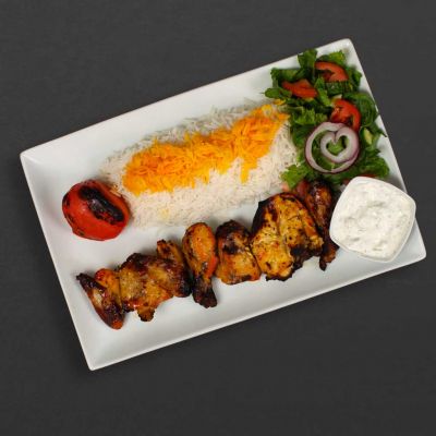 Cornish Chicken Kebab Plate with rice, tomato, salad, and maust o khiar.