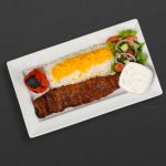 Kabab Barg plate with rice, tomato, salad, and maust o khiar.