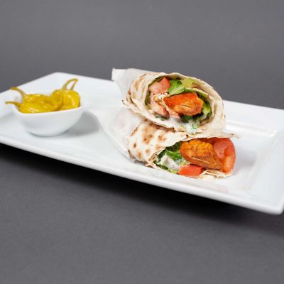 Salmon wrap with pepperoncini's on the side.